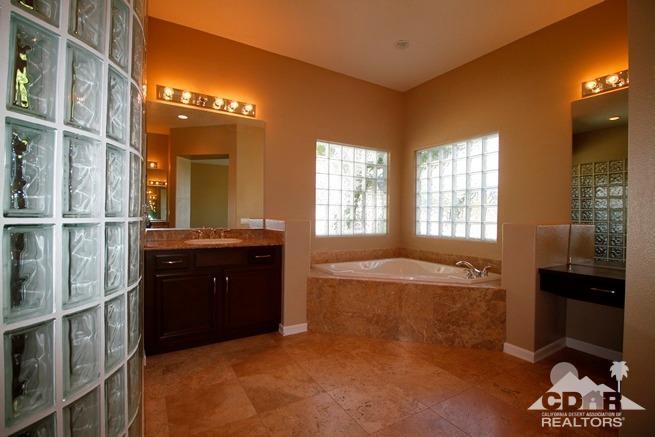 324 Loch Lomond Road Rancho Mirage, CA 92270 - Photo 30 of 51 a spacious bathroom with a bathtub and a shower