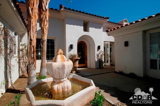 324 Loch Lomond Road Rancho Mirage, CA 92270 - Photo 4 of 51 a front view of a house with garden