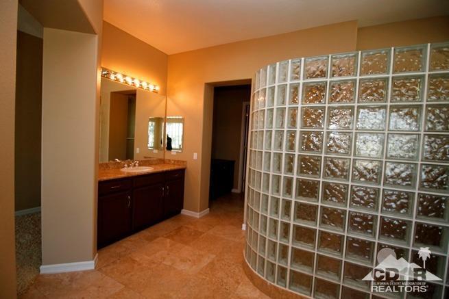 324 Loch Lomond Road Rancho Mirage, CA 92270 - Photo 31 of 51 a bathroom with a double vanity sink and a mirror