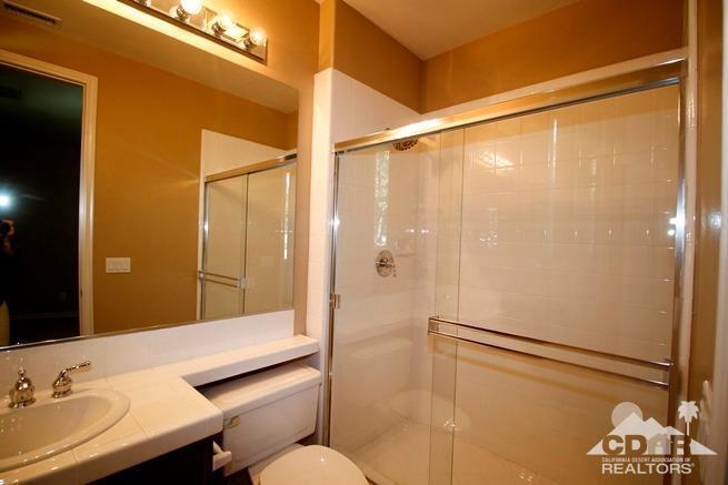 324 Loch Lomond Road Rancho Mirage, CA 92270 - Photo 35 of 51 a bathroom with a sink and mirror
