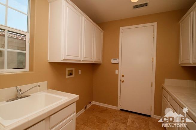 324 Loch Lomond Road Rancho Mirage, CA 92270 - Photo 36 of 51 a bathroom with a sink and a mirror