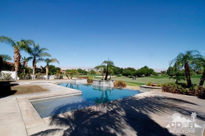 324 Loch Lomond Road Rancho Mirage, CA 92270 - Photo 39 of 51 a view of swimming pool with outdoor seating and lake in the back