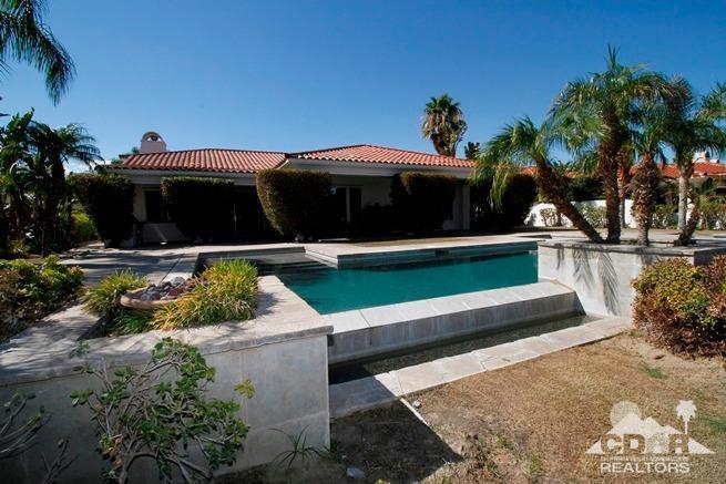 324 Loch Lomond Road Rancho Mirage, CA 92270 - Photo 44 of 51 a front view of a house with garden