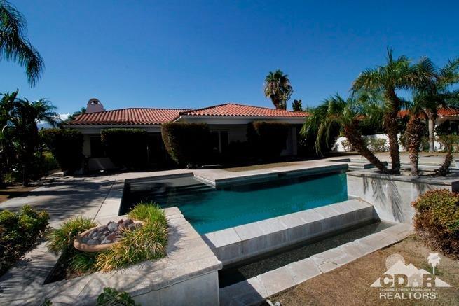 324 Loch Lomond Road Rancho Mirage, CA 92270 - Photo 45 of 51 a front view of a house with a yard