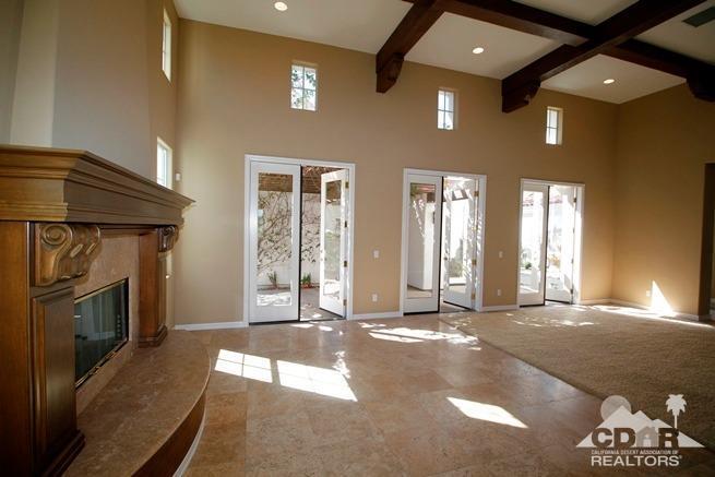 324 Loch Lomond Road Rancho Mirage, CA 92270 - Photo 7 of 51 a view of a livingroom with a fireplace and window