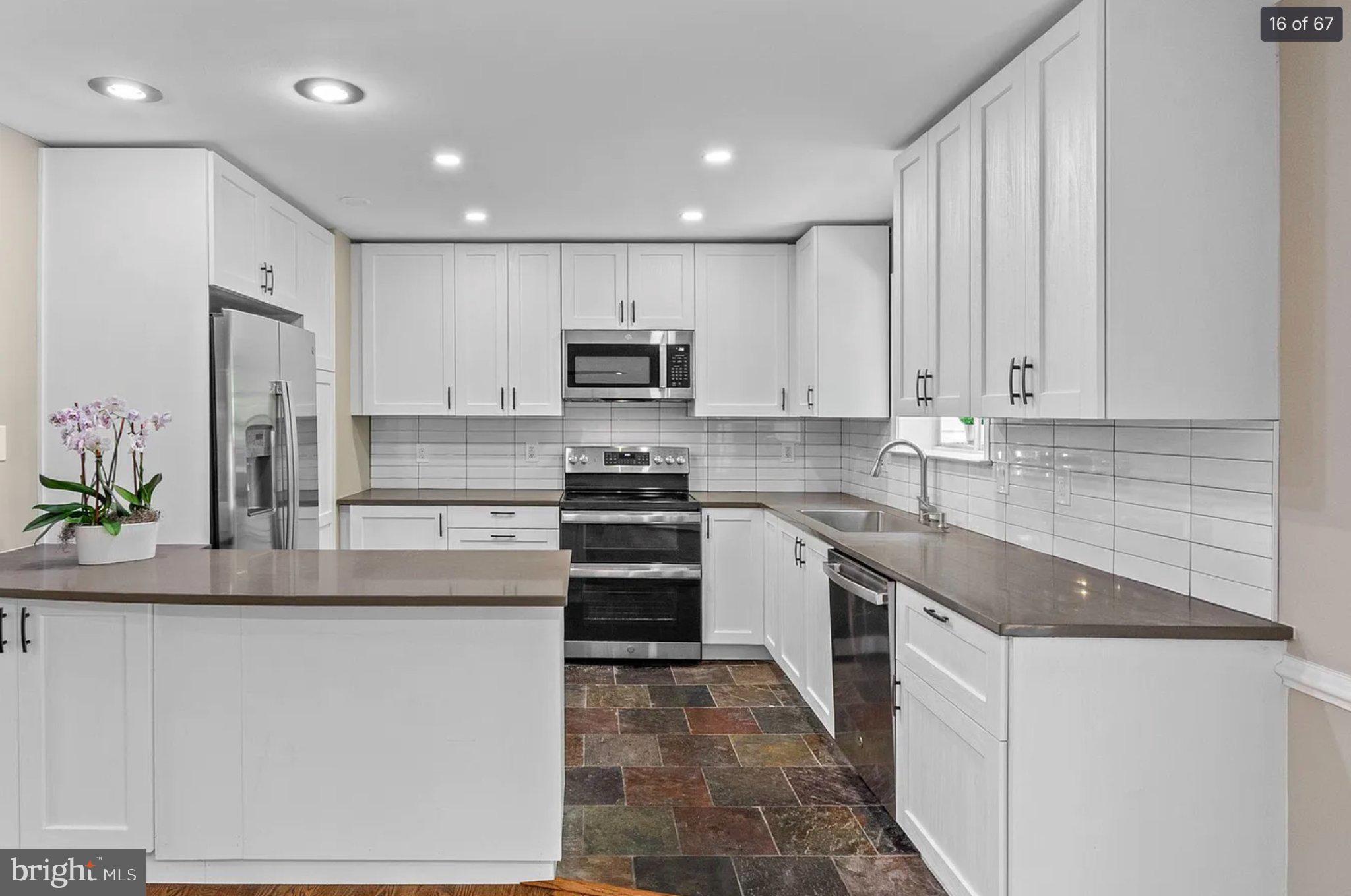 3906 Valley Ridge Drive Fairfax, VA 22033 - Photo 16 of 58 Modern kitchen with sleek finishes.