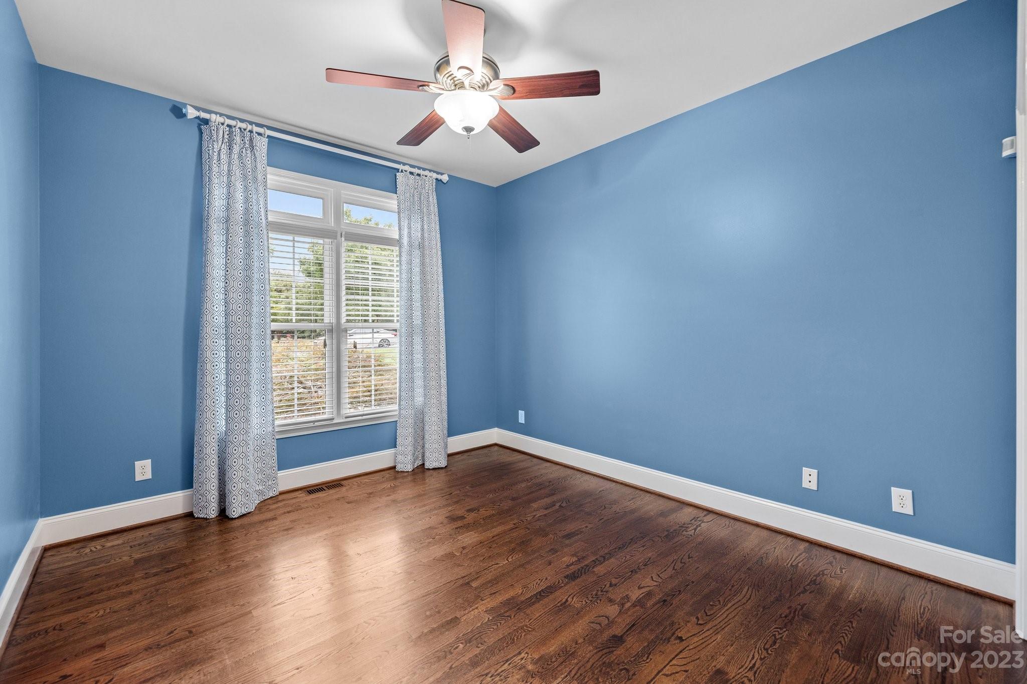 308 Gringley Hill Road Fort Mill, SC 29708 - Photo 16 of 23 wooden floor in an empty room with a window