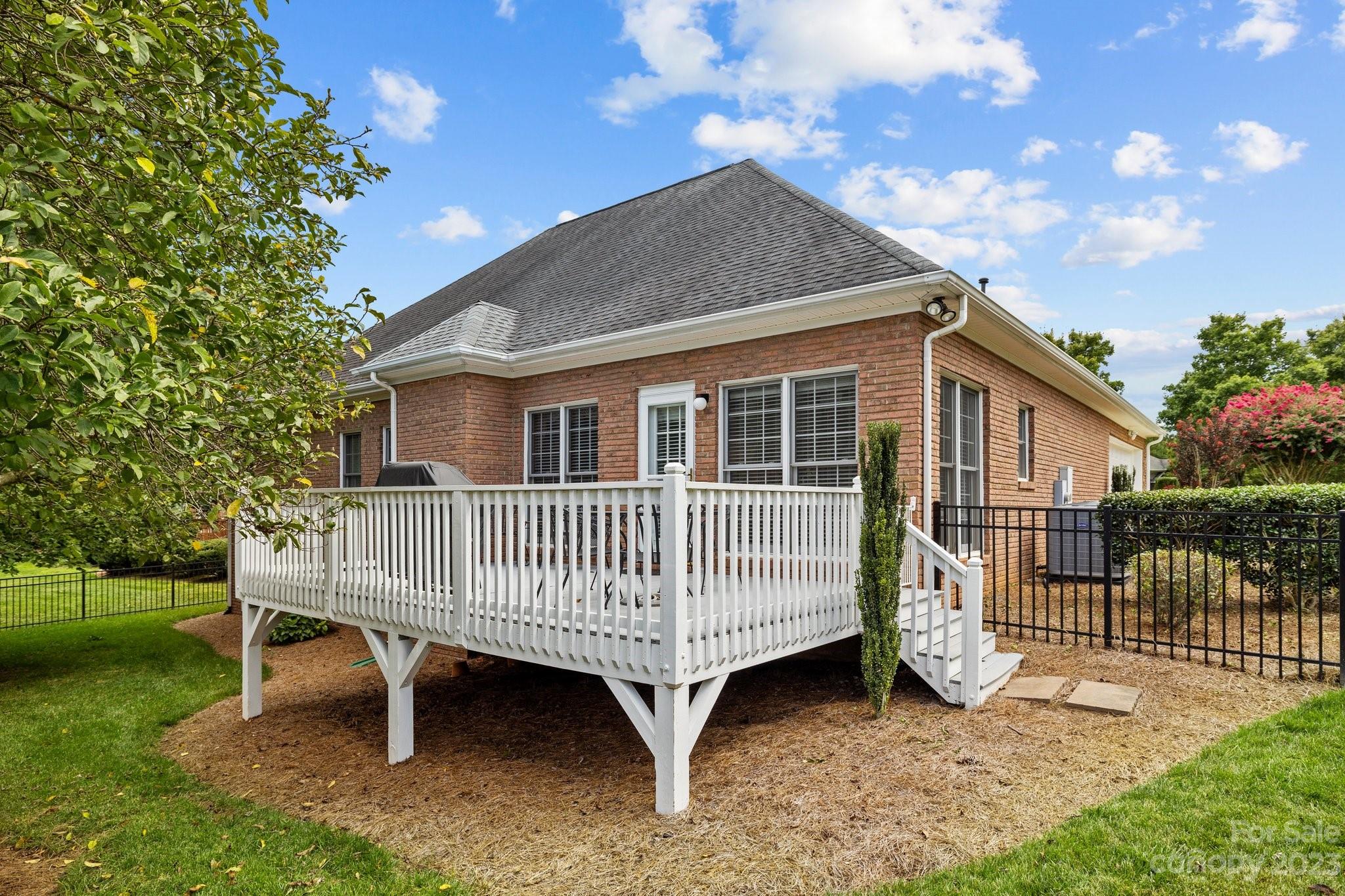 308 Gringley Hill Road Fort Mill, SC 29708 - Photo 21 of 23 a view of a house with a yard and deck