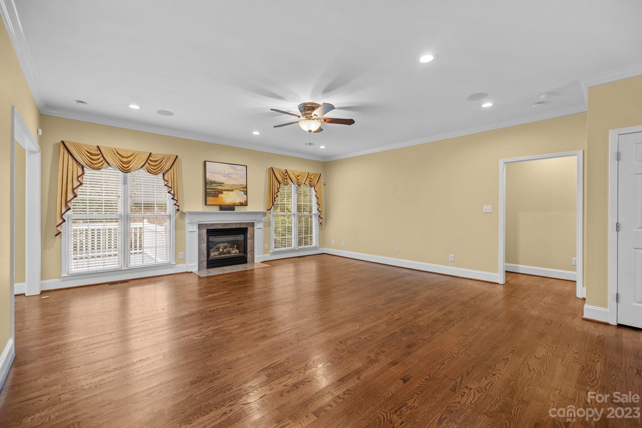 308 Gringley Hill Road Fort Mill, SC 29708 - Photo 5 of 23 a view of an empty room with a fireplace and a window
