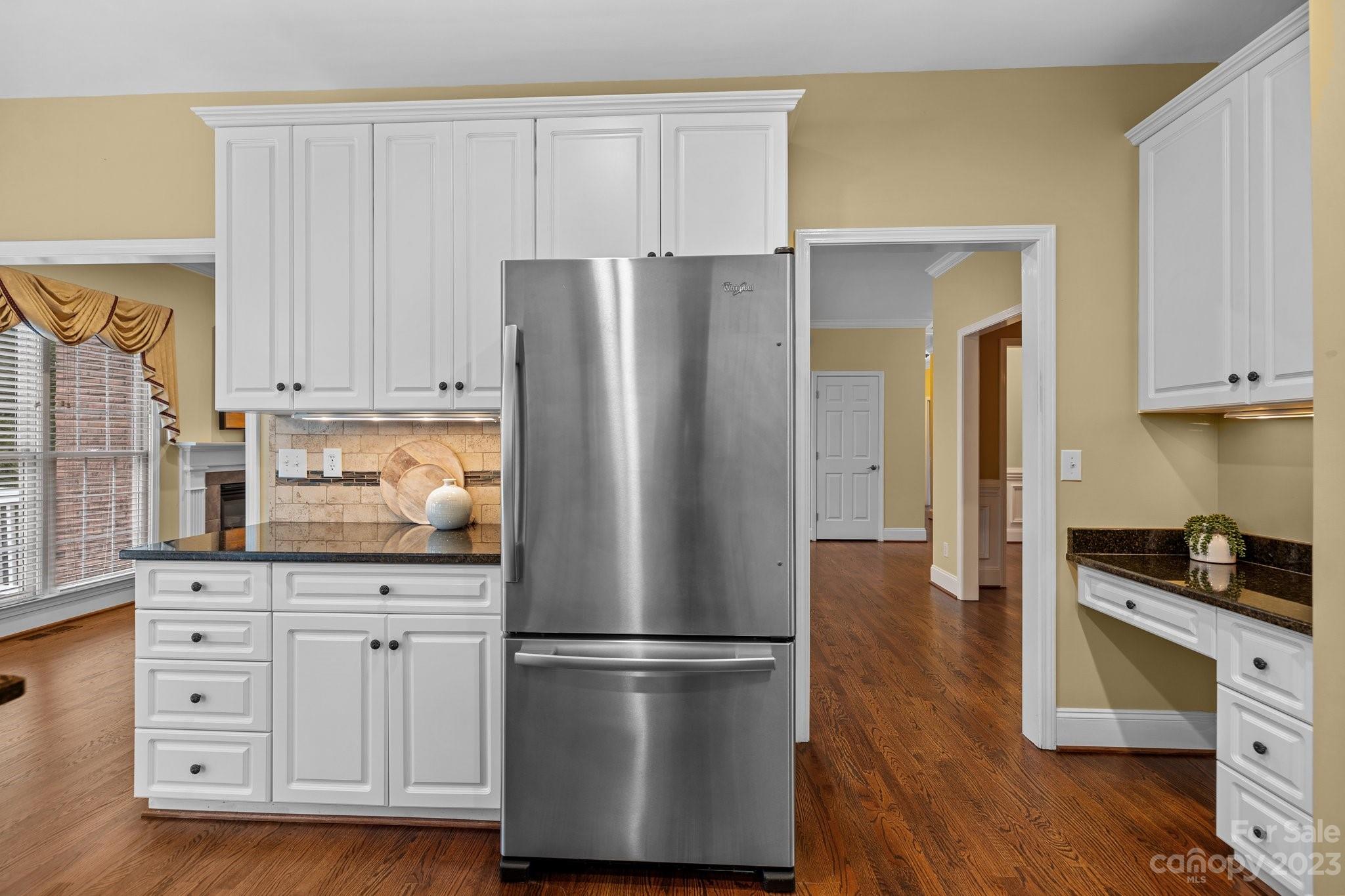 308 Gringley Hill Road Fort Mill, SC 29708 - Photo 8 of 23 a kitchen with stainless steel appliances white cabinets and a refrigerator