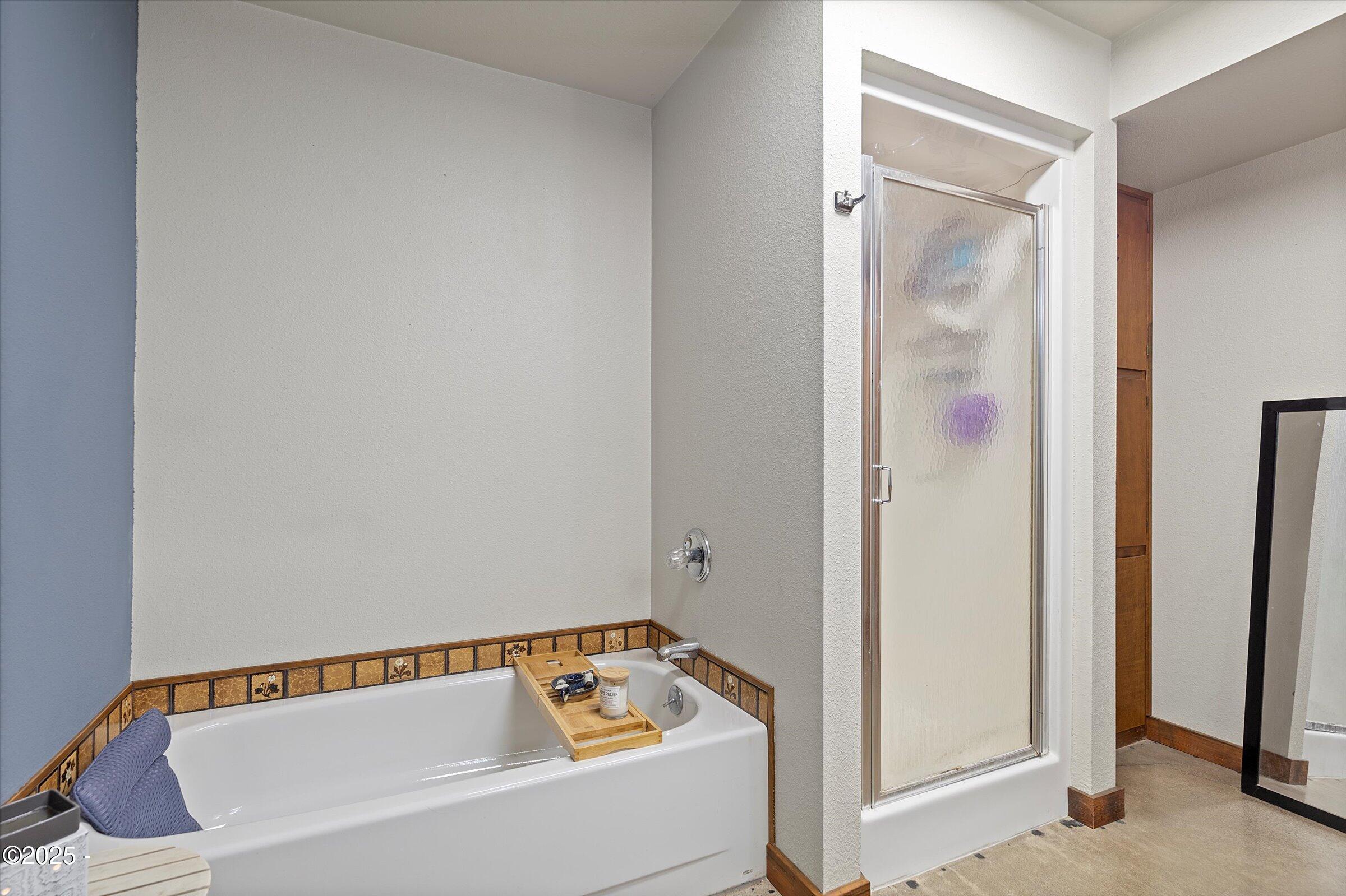 21560 Gooseneck Road Sheridan, OR 97378 - Photo 38 of 63 a bathroom with a bathtub and shower