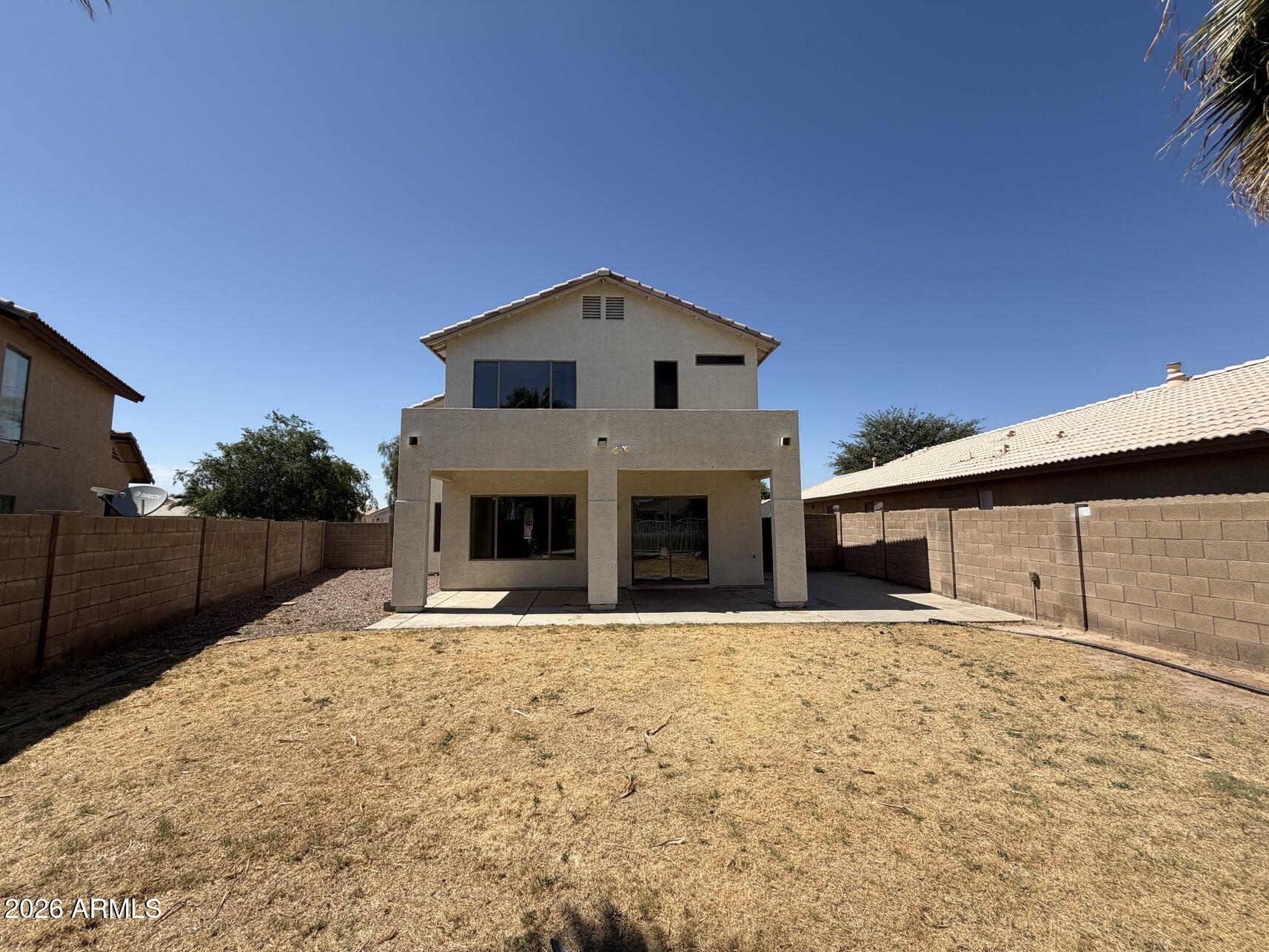 10807 West Monte Vista Road Avondale, AZ 85392 - Photo 7 of 33 a front view of a house with a yard