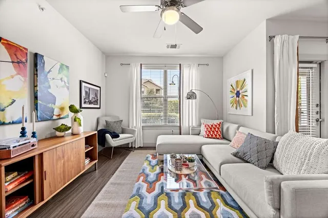 a living room with furniture and a window
