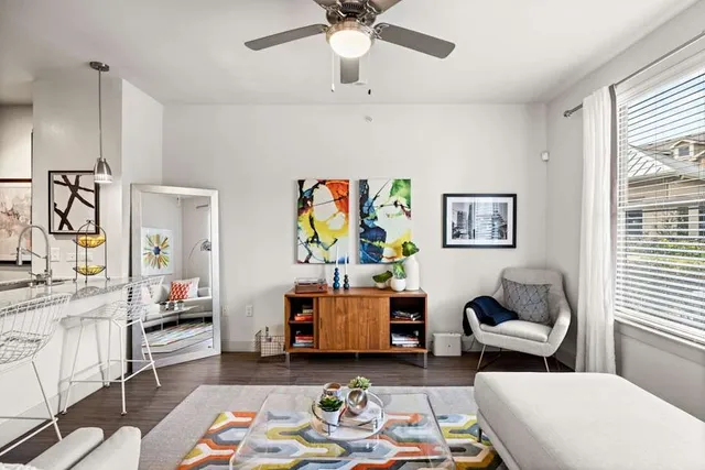 a living room with furniture and a window