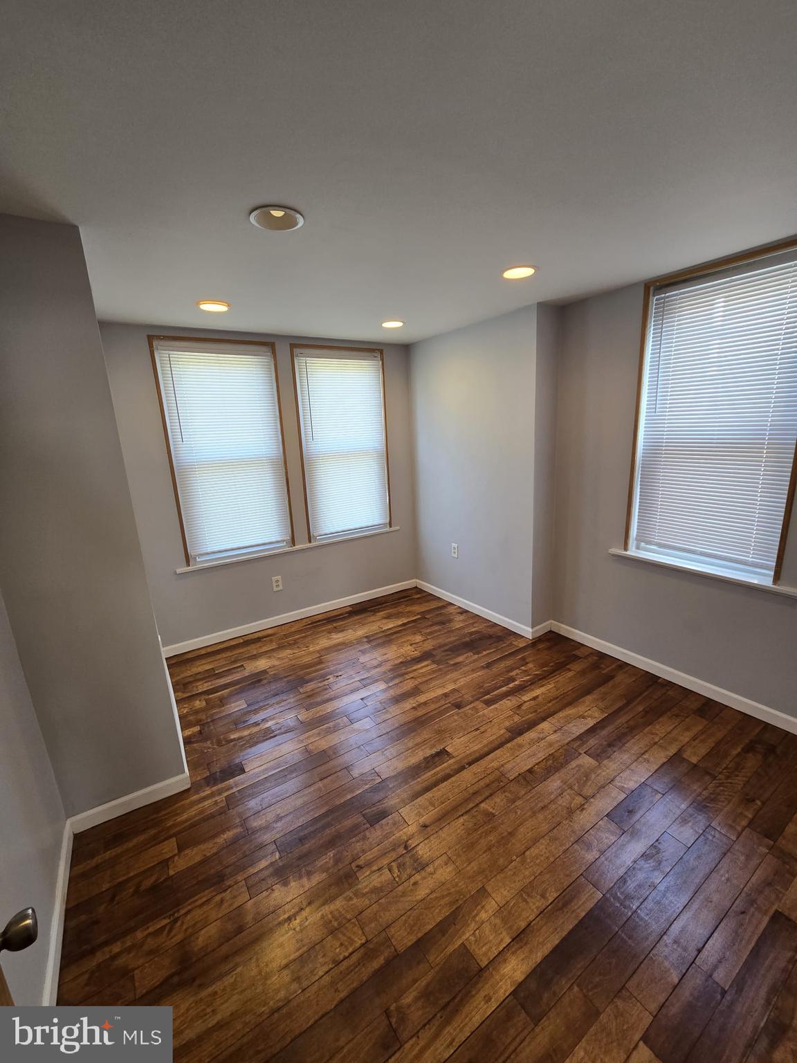3410 North 16th Street Philadelphia, PA 19140 - Photo 15 of 20 a view of empty room with wooden floor and fan
