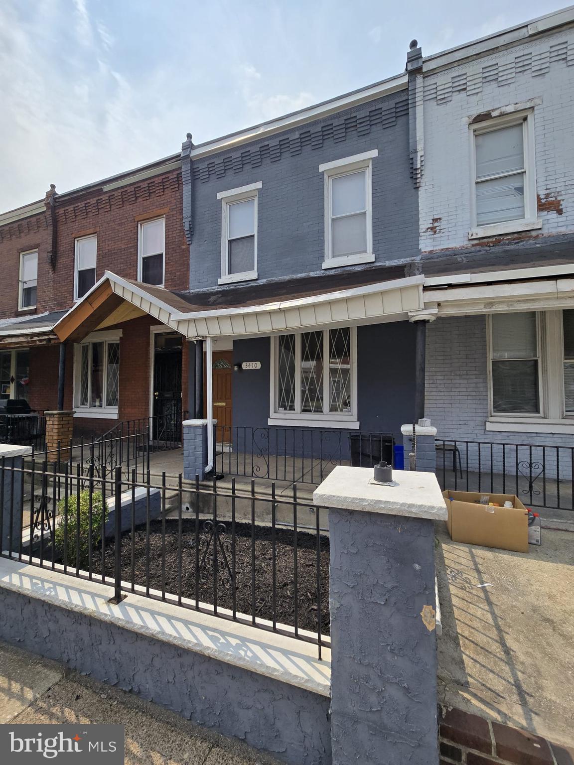 3410 North 16th Street Philadelphia, PA 19140 - Photo 2 of 20 a front view of a house with a yard