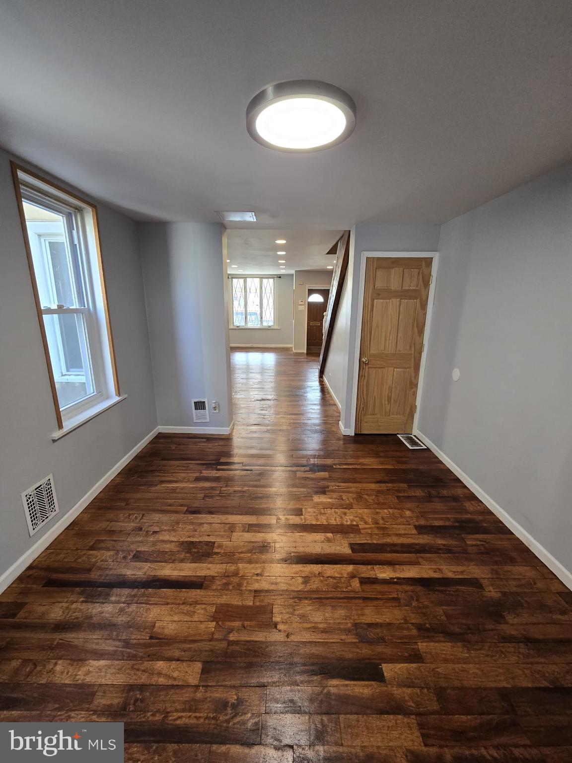 3410 North 16th Street Philadelphia, PA 19140 - Photo 9 of 20 a view of empty room with window and wooden floor
