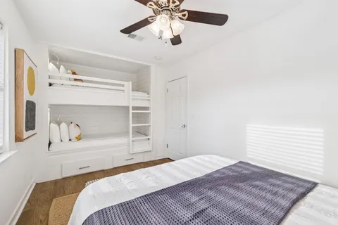 a view of storage and utility room with wooden floor