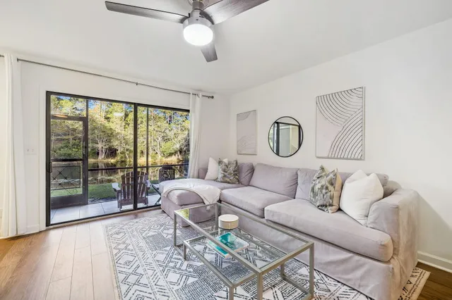 a bedroom with a bed and glass window