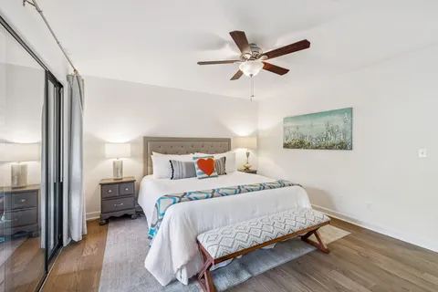 a bedroom with a bed and a flat screen tv