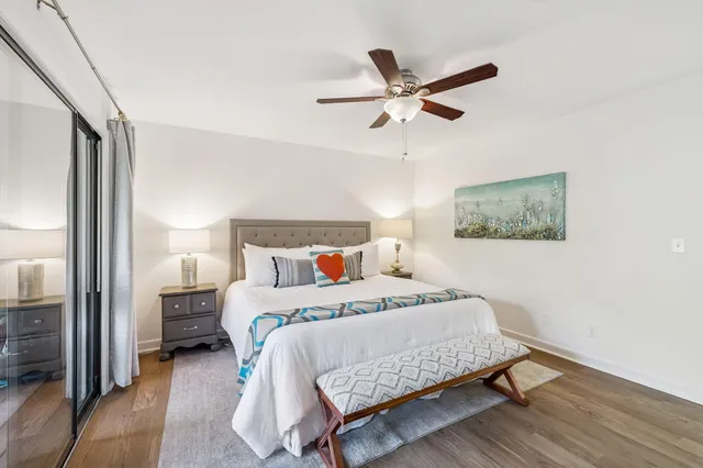 a bedroom with a bed and a flat screen tv