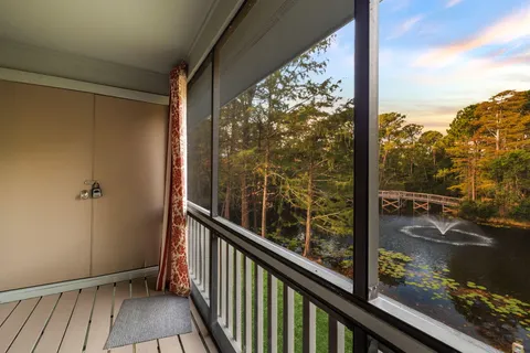 a room with wooden floor and a window