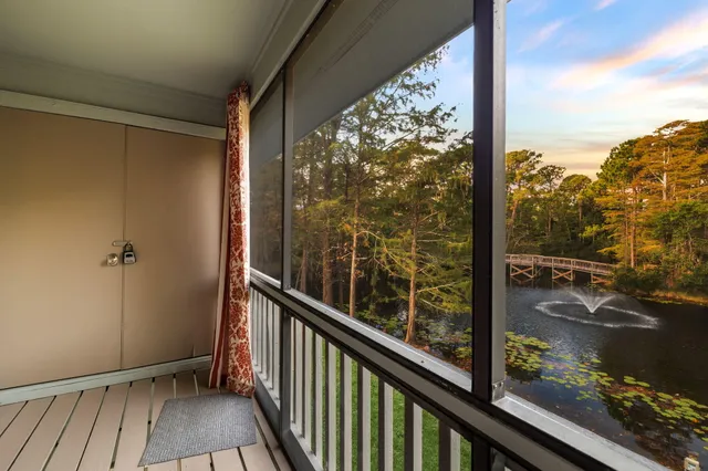 a room with wooden floor and a window