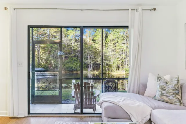a view of a chair and tables in the balcony