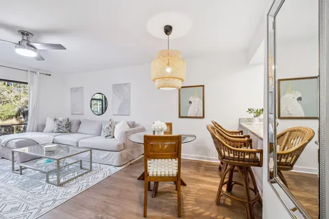 a view of a dining room with furniture and wooden floor