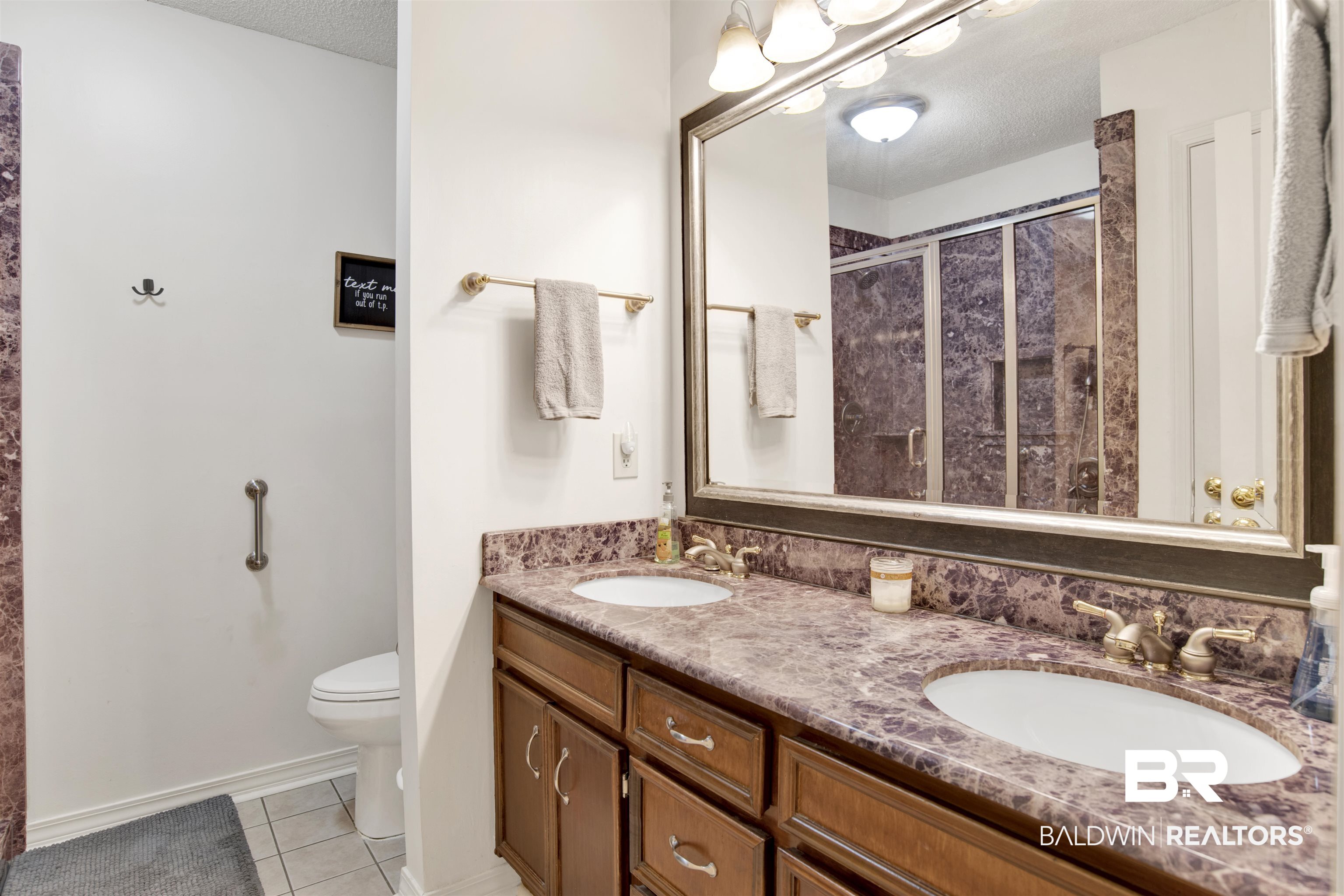 7431 Summer Court Mobile, AL 36695 - Photo 21 of 37 Full bath featuring a shower stall, tile patterned floors, toilet, double vanity, and a textured ceiling
