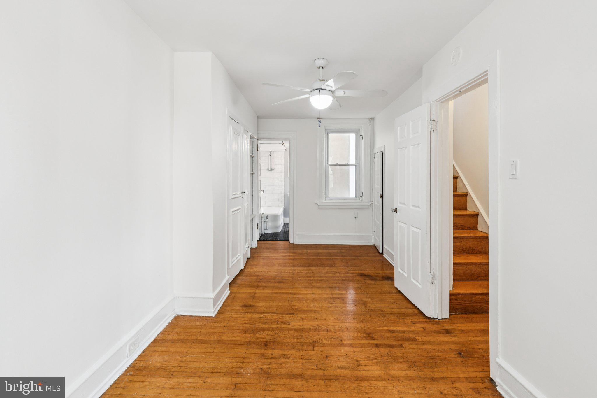1830 R Manning Street, Unit 2 Philadelphia, PA 19103 - Photo 24 of 32 a view of a hallway with wooden floor and staircase