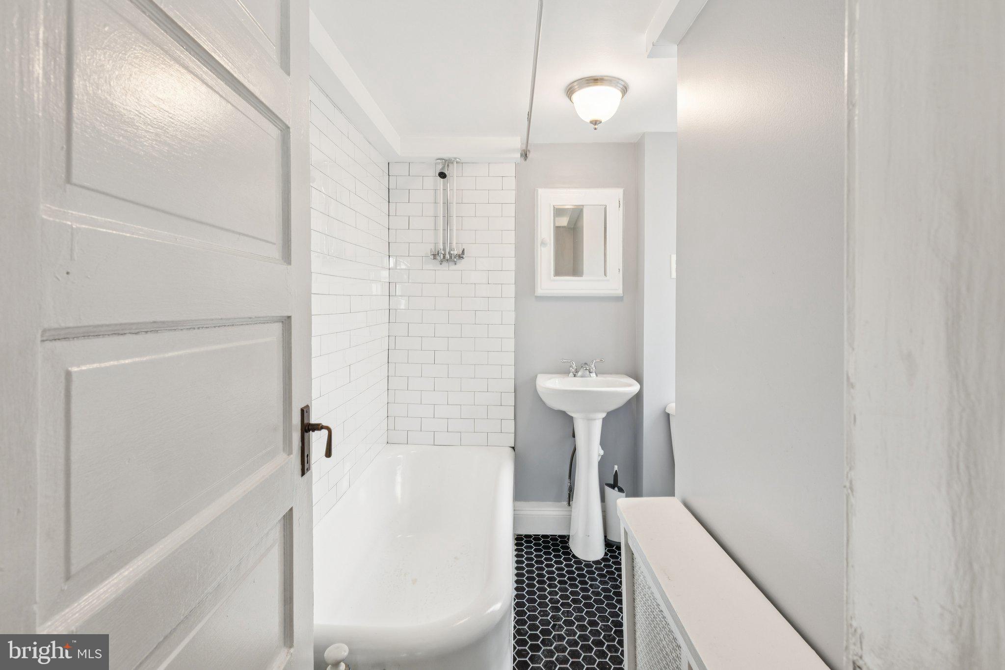 1830 R Manning Street, Unit 2 Philadelphia, PA 19103 - Photo 26 of 32 a bathroom with a sink and shower