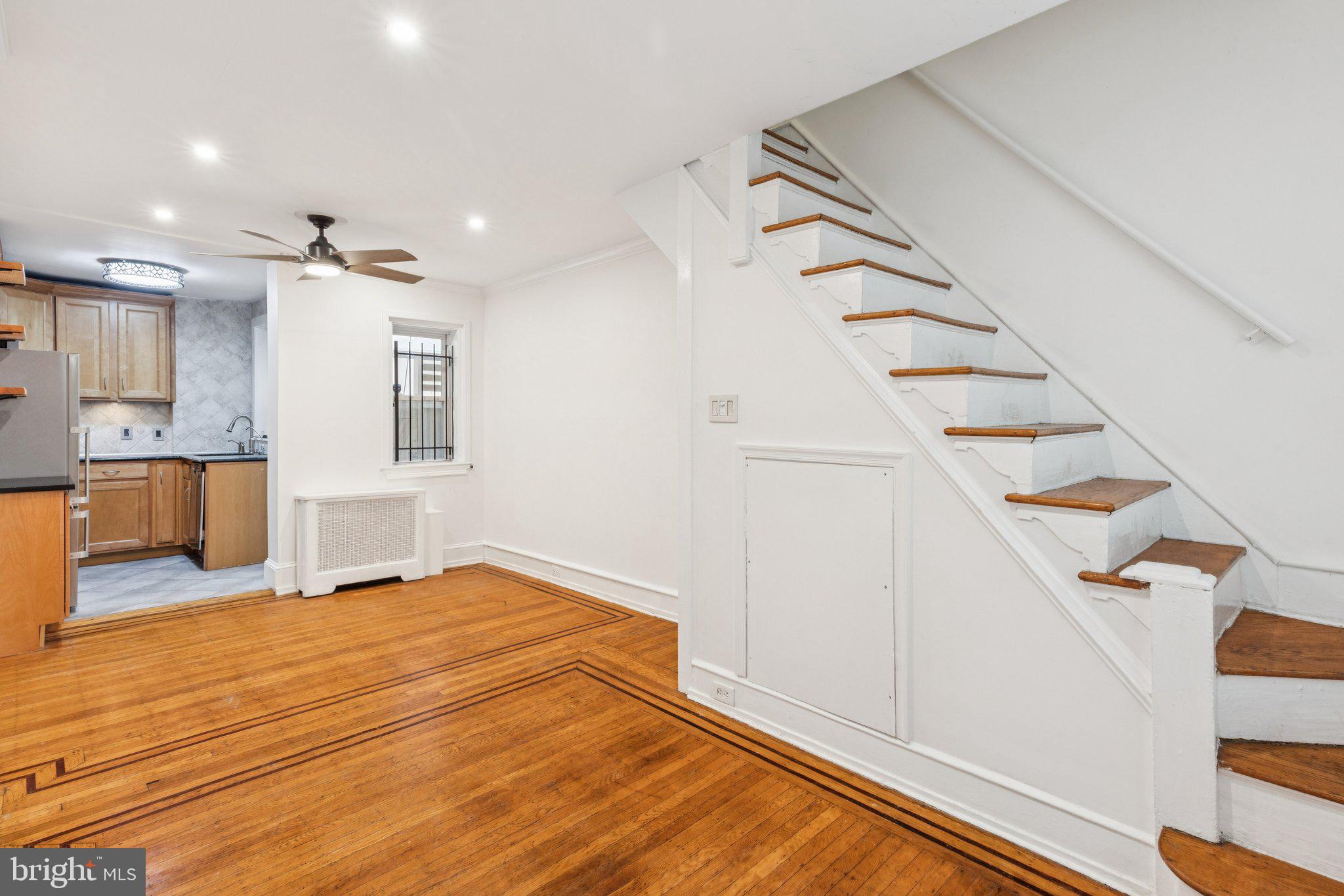 1830 R Manning Street, Unit 2 Philadelphia, PA 19103 - Photo 8 of 32 a view of an empty room with kitchen and a window