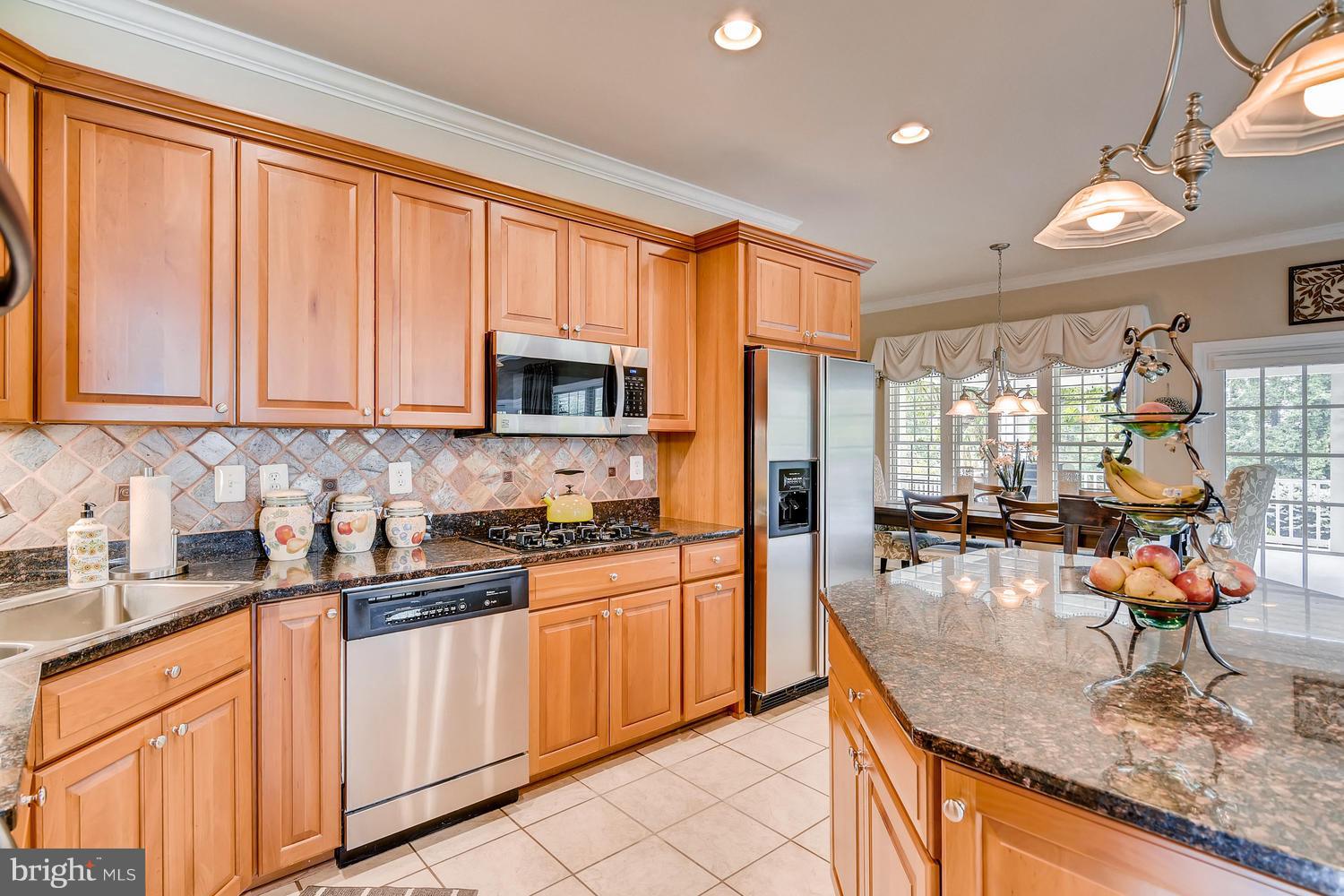 6405 Catalpa Road Fork, MD 21051 - Photo 9 of 30 Ceramic Tile Floors and Stone Backsplash