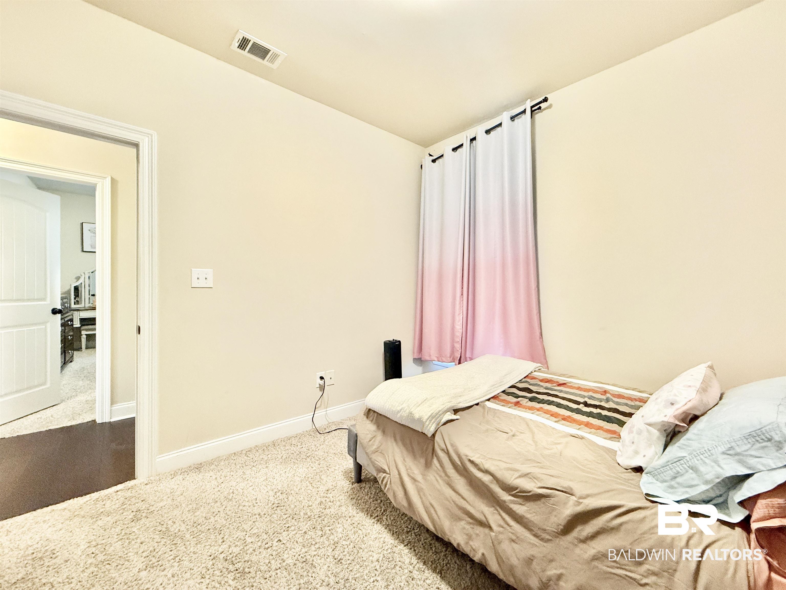 7011 Rocky Rd Loop Gulf Shores, AL 36542 - Photo 40 of 66 Bedroom with carpet flooring and baseboards