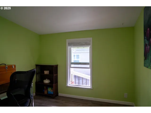 a view of a patio with table and chairs with wooden fence and plants