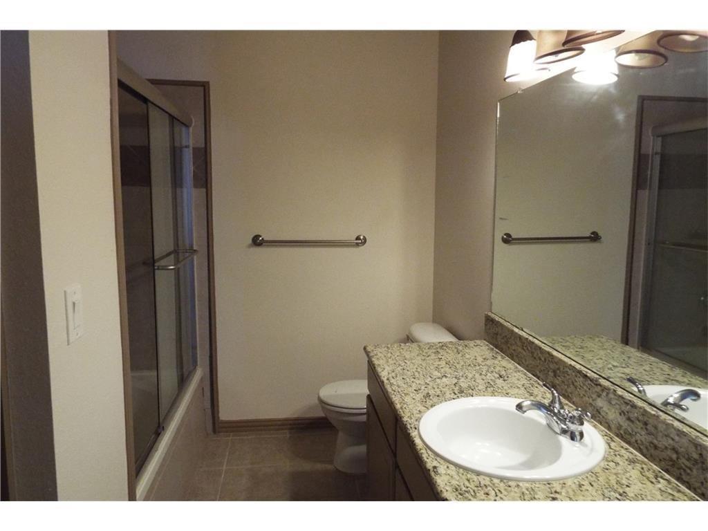 2601 Preston Road, Unit 5209 Plano, TX 75093 - Photo 14 of 18 a bathroom with a sink and a mirror