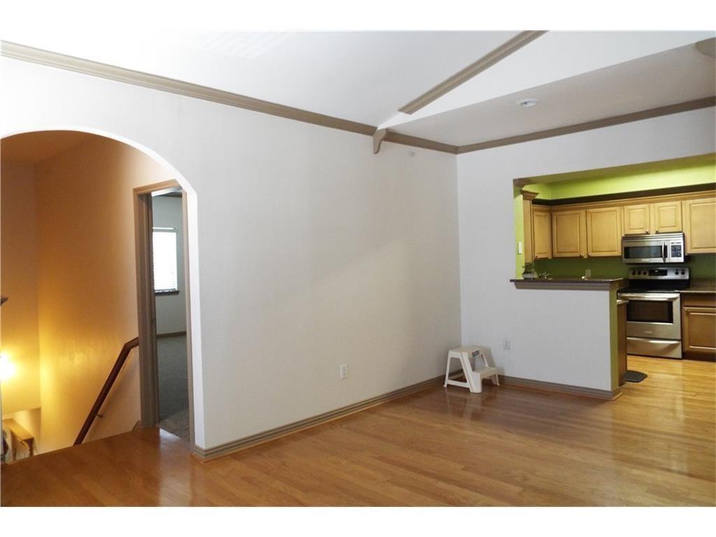 2601 Preston Road, Unit 5209 Plano, TX 75093 - Photo 4 of 18 a view of empty room with wooden floor and fan