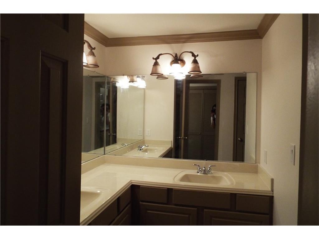 2601 Preston Road, Unit 5209 Plano, TX 75093 - Photo 10 of 18 a bathroom with a sink and a mirror