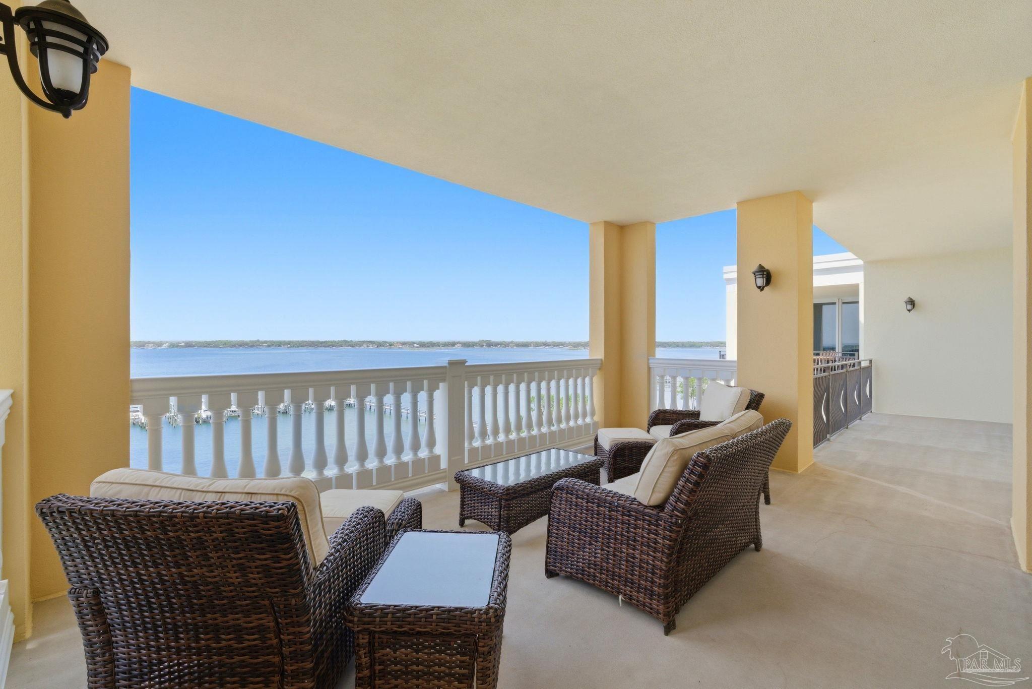 14500 River Road, Unit 504 Perdido Key, FL 32507 - Photo 3 of 61 a living room with furniture a large window and a rug