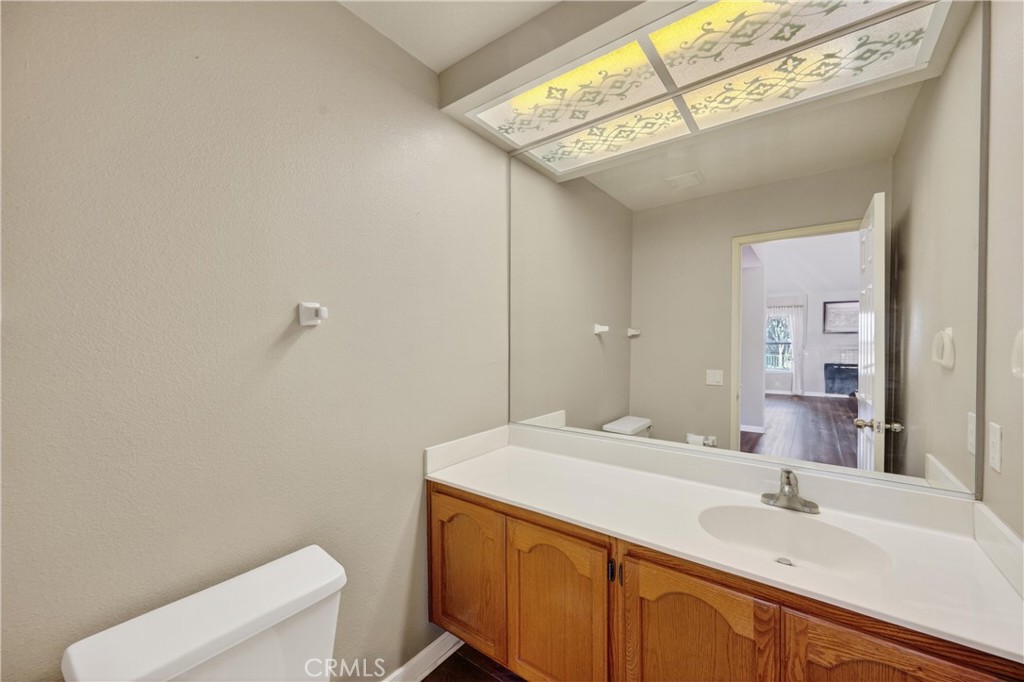 11056 Orchard View Lane Riverside, CA 92503 - Photo 22 of 50 a bathroom with a sink a toilet and vanity
