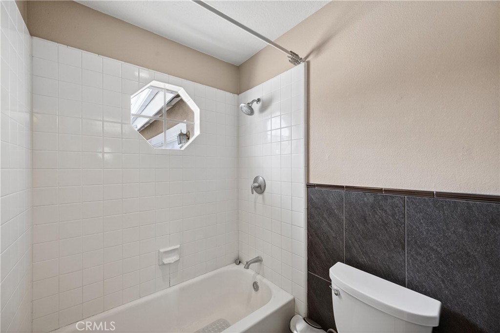 11056 Orchard View Lane Riverside, CA 92503 - Photo 25 of 50 a bathroom with a toilet and a bathtub