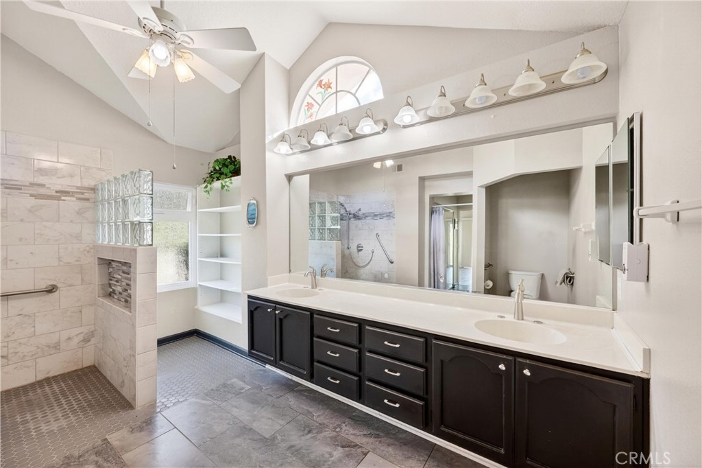 11056 Orchard View Lane Riverside, CA 92503 - Photo 29 of 50 a spacious bathroom with a double vanity sink a large mirror and a shower