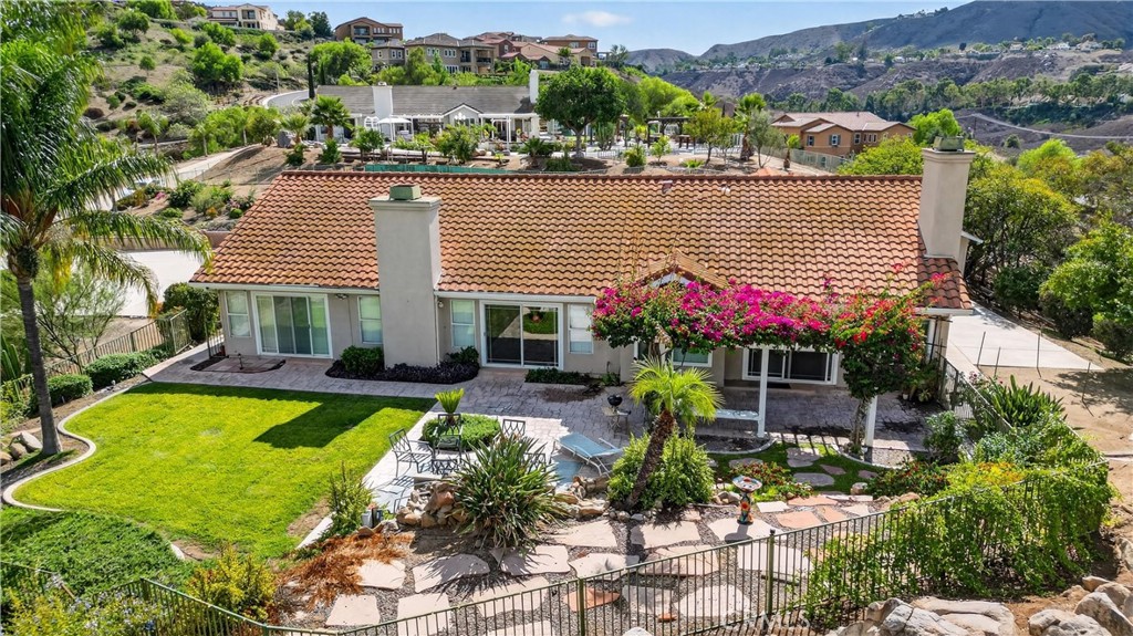 11056 Orchard View Lane Riverside, CA 92503 - Photo 45 of 50 a view of a house with swimming pool and a chairs