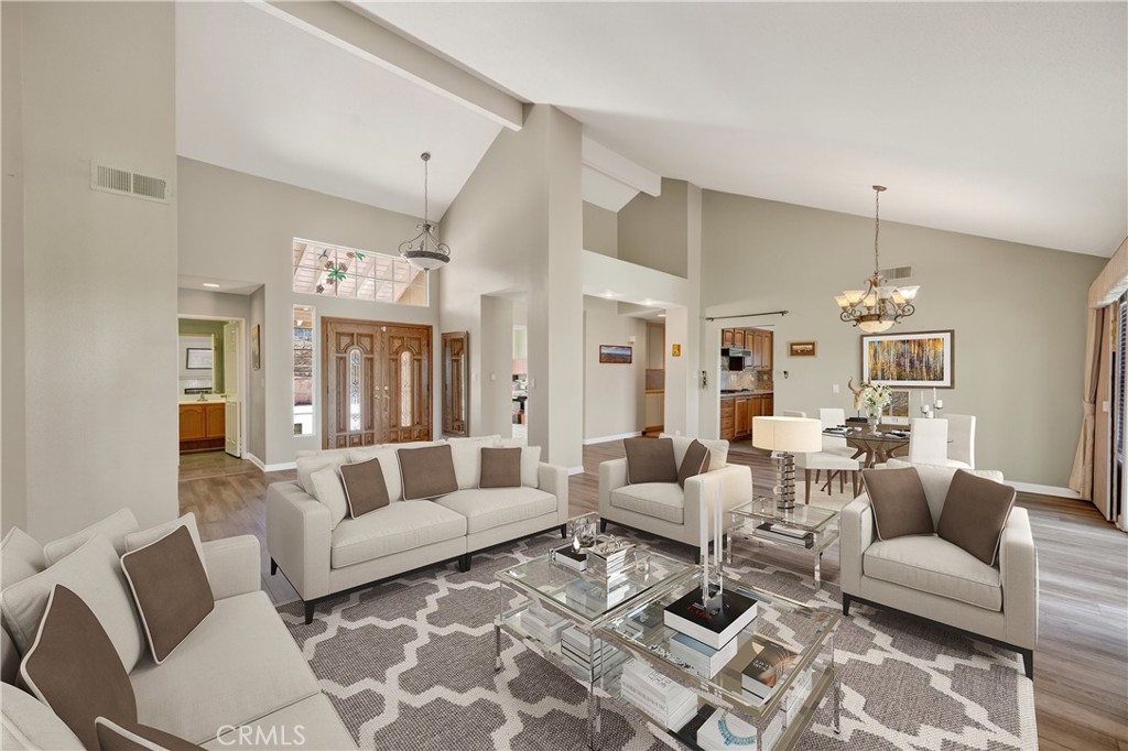 11056 Orchard View Lane Riverside, CA 92503 - Photo 7 of 50 a living room with furniture and a chandelier