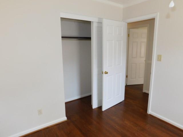 879 Forest Ridge Drive Southeast Marietta, GA 30067 - Photo 14 of 29 an empty room with wooden floor and closet