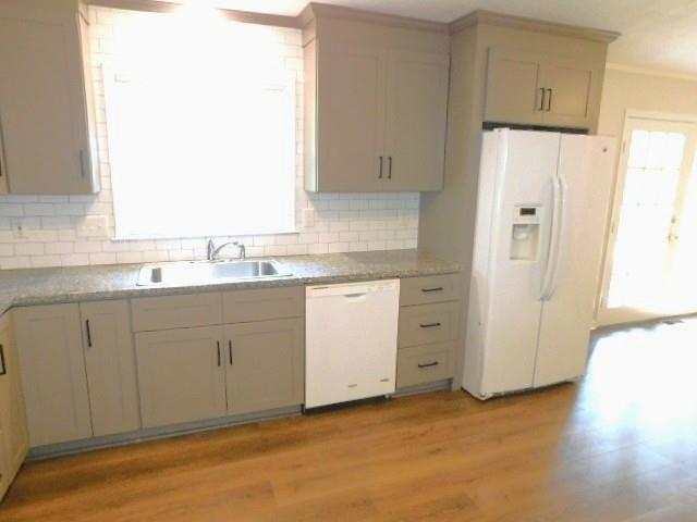 879 Forest Ridge Drive Southeast Marietta, GA 30067 - Photo 22 of 29 a kitchen with white cabinets and refrigerator