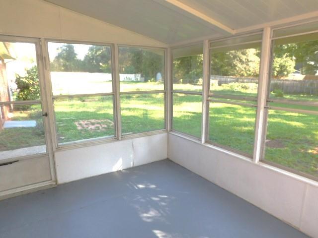 879 Forest Ridge Drive Southeast Marietta, GA 30067 - Photo 26 of 29 a view of an empty room with wooden floor and a large window with pool view