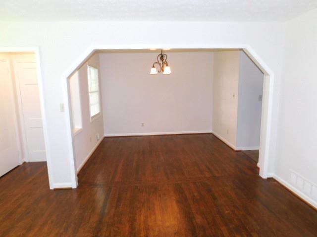 879 Forest Ridge Drive Southeast Marietta, GA 30067 - Photo 4 of 29 an empty room with wooden floor and windows