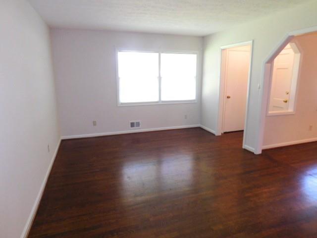 879 Forest Ridge Drive Southeast Marietta, GA 30067 - Photo 5 of 29 an empty room with wooden floor and windows